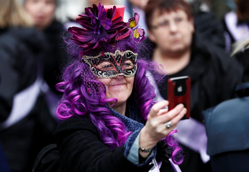 A woman takes a selfie during a protest against ...