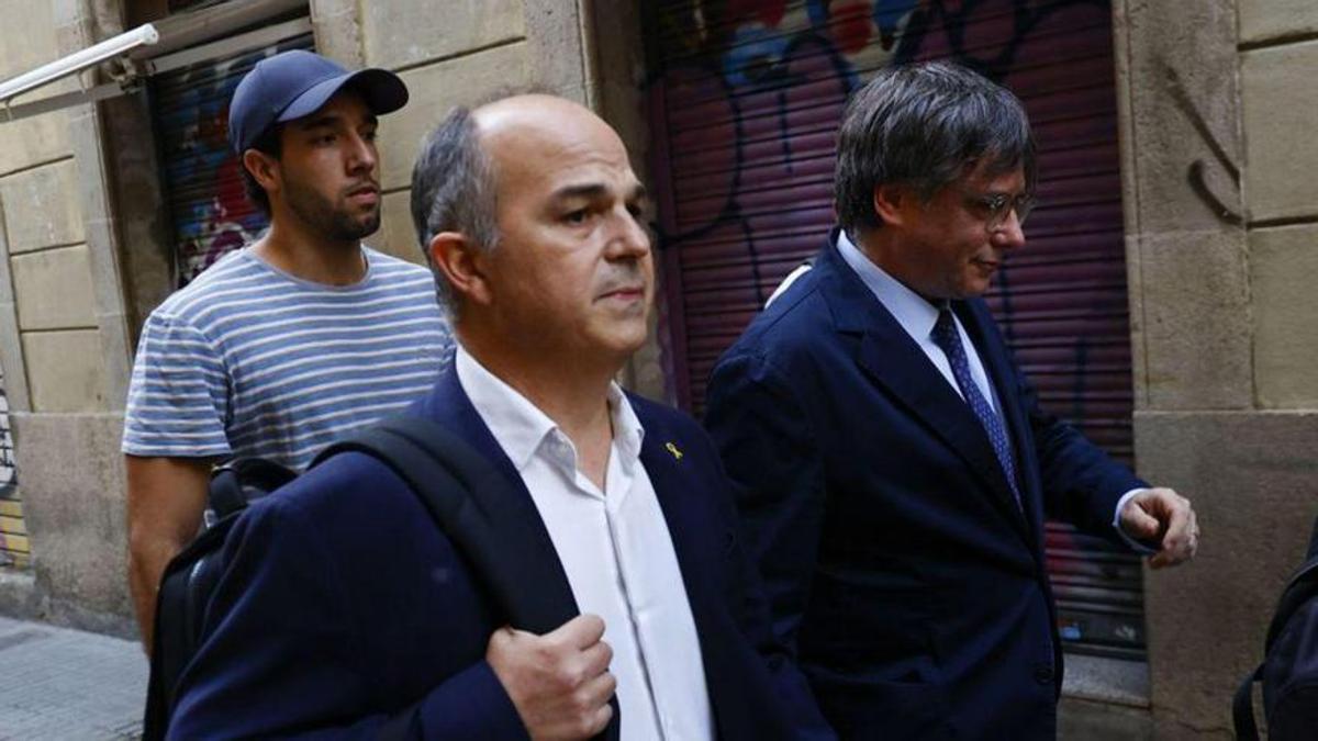 Jordi Turull y Carles Puigdemont, durante su regreso fugaz a Barcelona