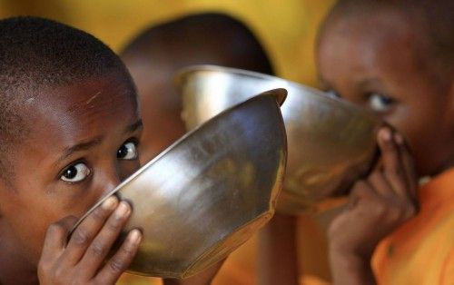 File photo of Somali refugees eating porridge during break time at the Liban integrated academy at the Ifo refugee camp in Dadaab