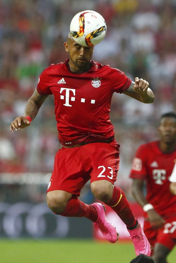 Bayern Munich's Vidal jumps for the ball during their pre-season Audi Cup tournament final soccer match against Real Madrid in Munich