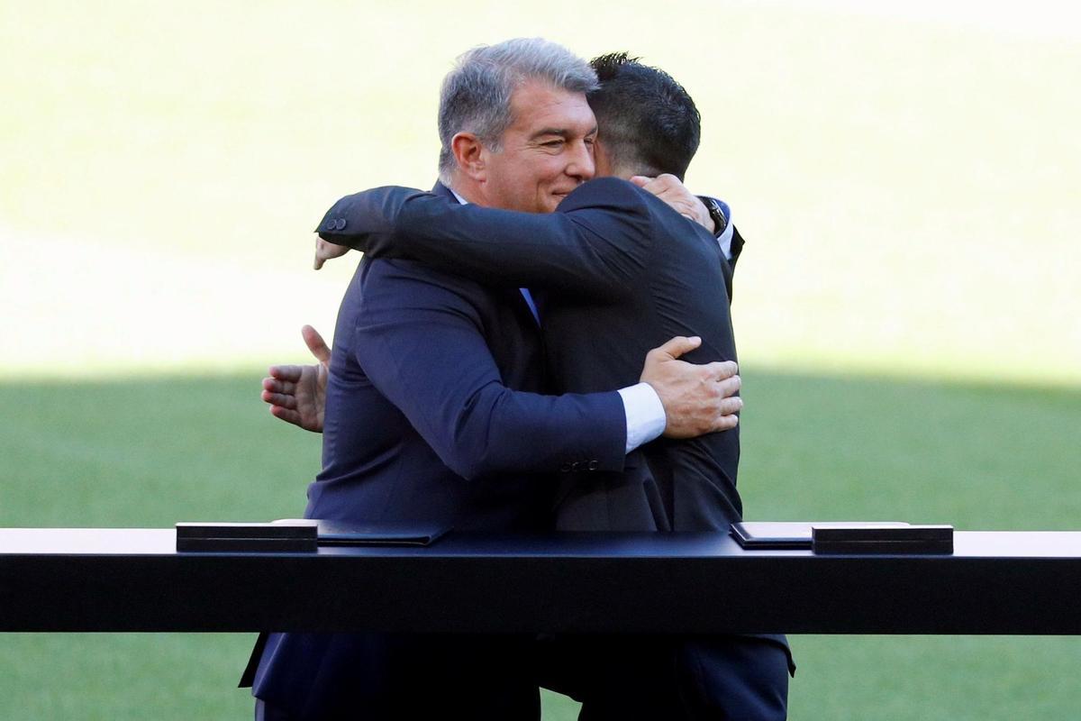 FC Barcelona’s new head coach, Xavi Hernandez (R), embraces FC Barcelona’s President, Joan Laporta, during his presentation at Camp Nou stadium in Barcelona, Spain, 08 November 2021. Xavi Hernandez left Al-Sadd club of Qatar to lead FC Barcelona for the rest of the current season and two more seasons. EFE/ Alejandro Garcia