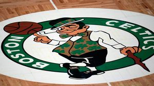 FILE - The Boston Celtics logo is seen at center court on the parquet floor before an NBA basketball game, Wednesday, April 28, 2021, in Boston. (AP Photo/Charles Krupa, File). FILE PHOTO