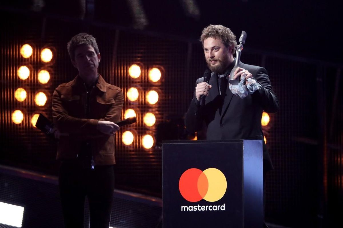 LONDON  ENGLAND - FEBRUARY 22    EDITORIAL USE ONLY   Duncan Jones  R  receives the Mastercard British Album of the Year award on belhalf of his father David Bowie from Noel Gallagher  L  on stage at The BRIT Awards 2017 at The O2 Arena on February 22  2017 in London  England    Photo by Mike Marsland Mike Marsland WireImage