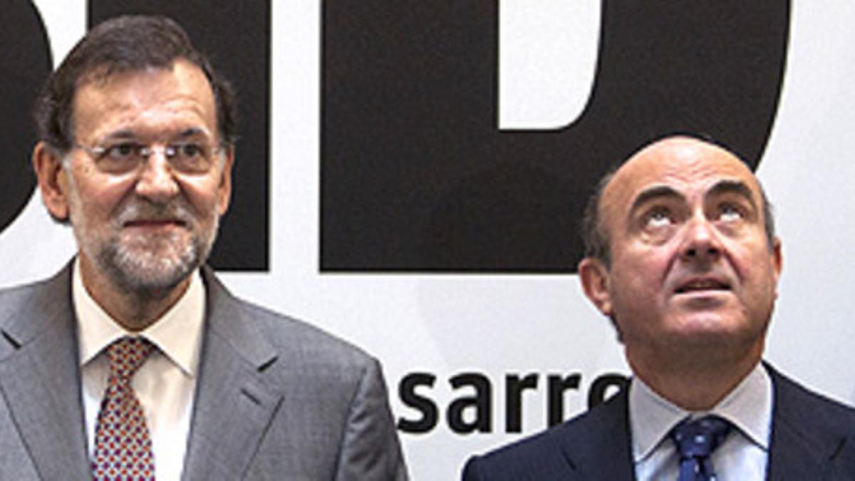 Mariano Rajoy y Luis de Guindos.