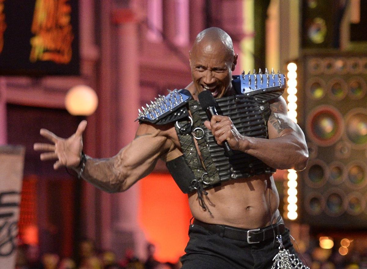 Host Dwayne Johnson takes the stage in this pool photo during the 2016 MTV Movie Awards in Los Angeles April 9, 2016 and released April 10, 2016.  REUTERS/Kevork Djansezian/Pool