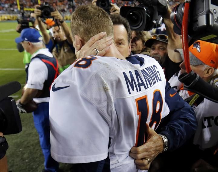 Denver Broncos' head coach Kubiak hugs quarterback Manning after the Broncos defeated the Carolina Panthers in the NFL's Super Bowl 50 football game in Santa Clara