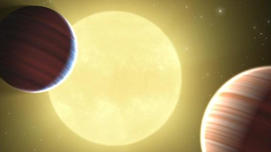 Dibujo artístico de los dos nuevos planetas similares a Saturno que orbitan alrededor de una estrella y otro tercer posible candidato de un tamaño aproximado a la Tierra.