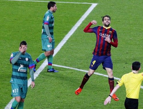 Barcelona's Cesc Fabregas celebrates his goal against Levante during their Spanish King's Cup soccer match at Nou Camp stadium in Barcelona