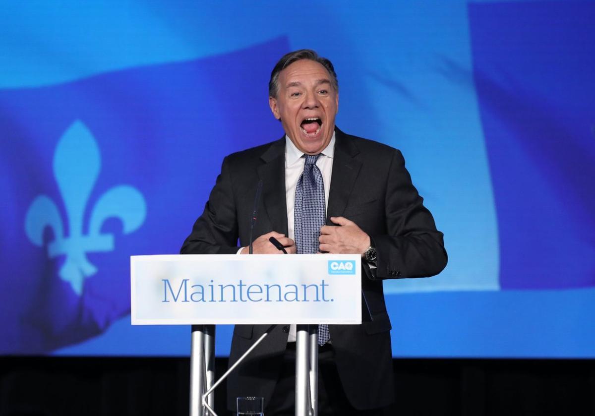 Coalition Avenir Quebec (CAQ) party leader Francois Legault speaks to supporters from the podium in Quebec City, Quebec, Canada October 1, 2018. REUTERS/Chris Wattie