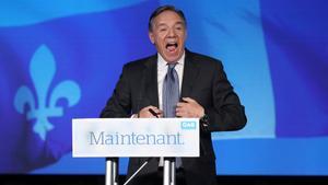 Coalition Avenir Quebec (CAQ) party leader Francois Legault speaks to supporters from the podium in Quebec City, Quebec, Canada October 1, 2018. REUTERS/Chris Wattie