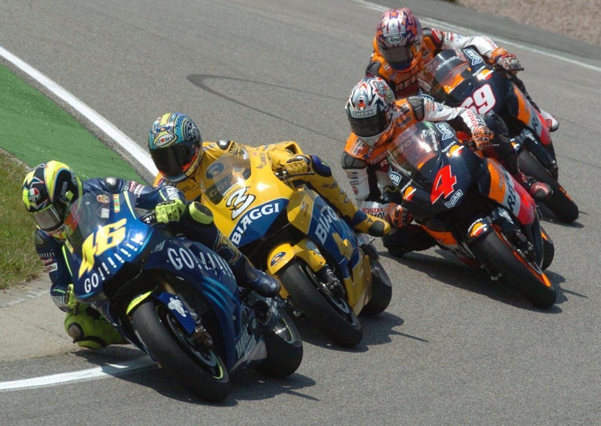 epa000235041 (L-R) Italian rider Valentino Rossi, Italian Max Biaggi Brazilian Alex Barros and US Nicky Hayden in action during the German Motorcycle Grand Prix at the Sachsenring circuit in Hohenstein-Ernstthal, eastern Germany, Sunday 18 July 2004. Biaggi won the race, Barros came in second followed by Hayden. Rossi took the fourth place. EFE/epa/Wolfgang Thieme