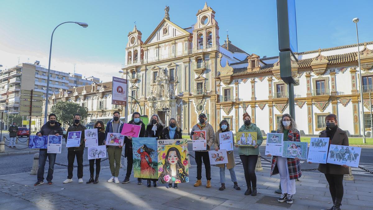 Participantes en el proyecto muestran el calendario frente a la Diputación.