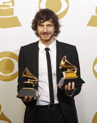 Gotye poses with the awards he won for Record of the Year and Best Pop Duo/Group Performance at the 55th annual Grammy Awards in Los Angeles