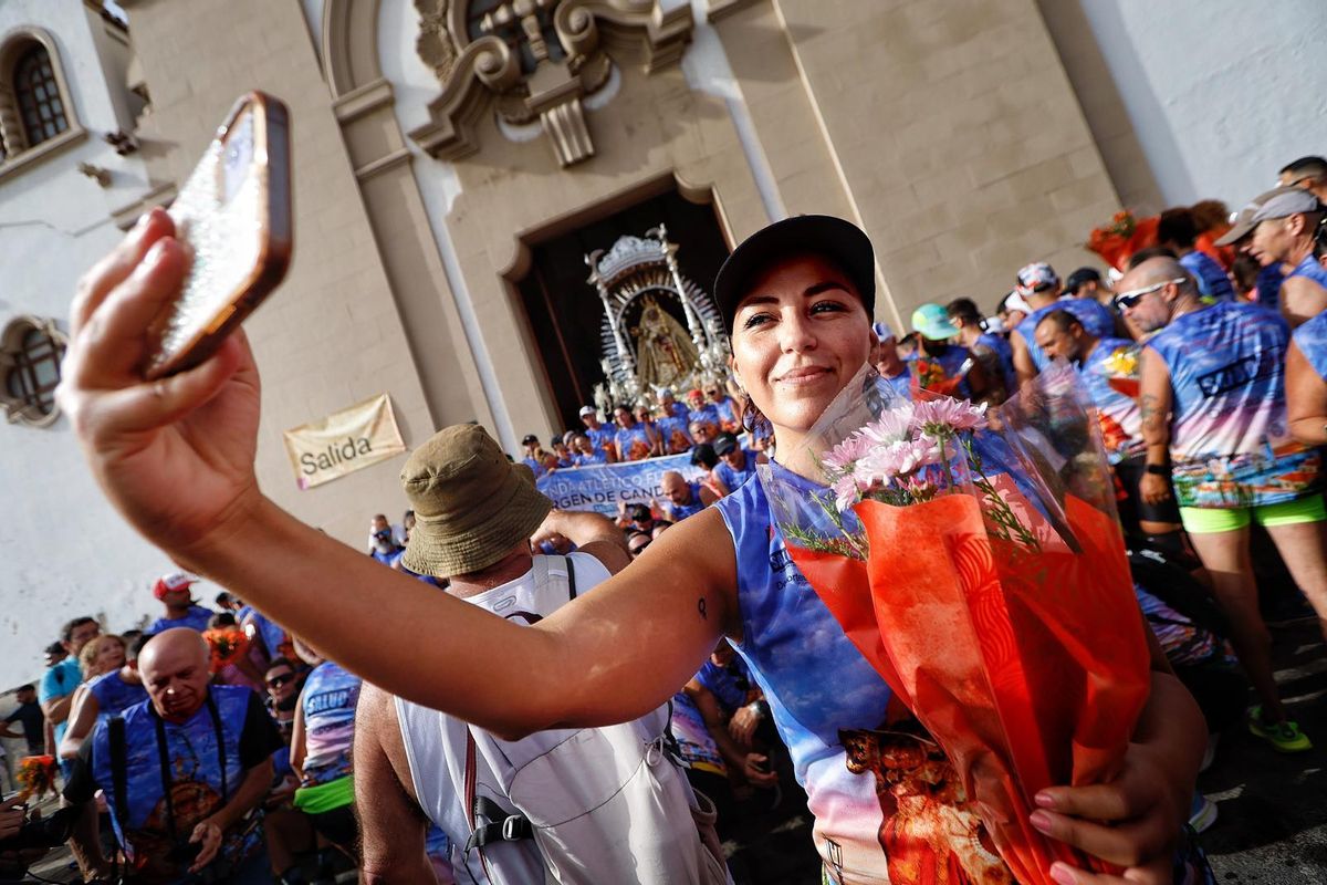 One of the runners from the floral offering taking a photo upon arriving at the Basilica