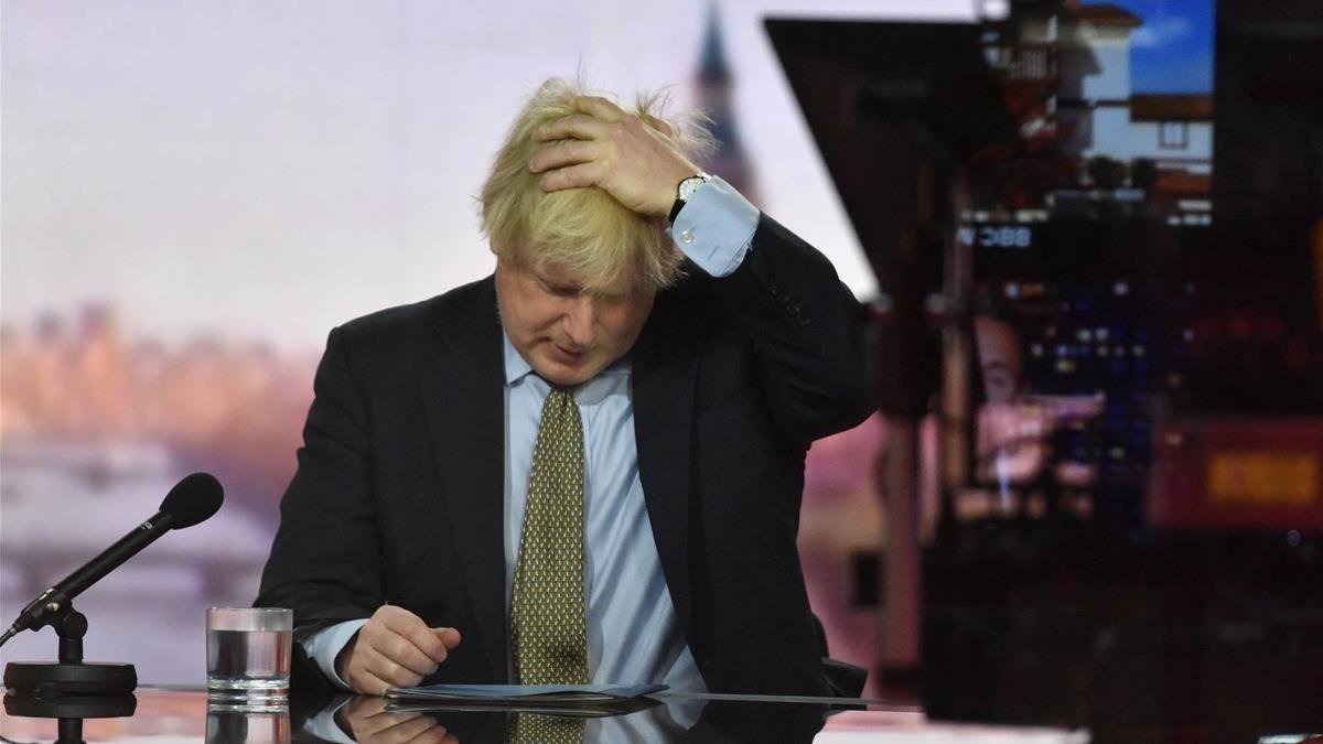 A handout picture released by the British Broadcasting Corporation (BBC) on January 3  2021 shows Britain s Prime Minister Boris Johnson appearing on the BBC s Andrew Marr Show weekly political programme at their studio in London  - British Prime Minister Boris Johnson said on January 3  2021 he was  reconciled  to the prospect of tougher restrictions to combat spiralling coronavirus cases  as a row flared over whether schools should reopen  (Photo by JEFF OVERS   BBC   AFP)   RESTRICTED TO EDITORIAL USE - MANDATORY CREDIT   AFP PHOTO   JEFF OVERS-BBC   - NO MARKETING NO ADVERTISING CAMPAIGNS - DISTRIBUTED AS A SERVICE TO CLIENTS TO REPORT ON THE BBC PROGRAMME OR EVENT SPECIFIED IN THE CAPTION - NO ARCHIVE - NO USE AFTER - JANUARY 24  2021   PICTURES ARE TAKEN FROM OUTSIDE THE STUDIO THROUGH GLASS CREATING RELFECTIONS