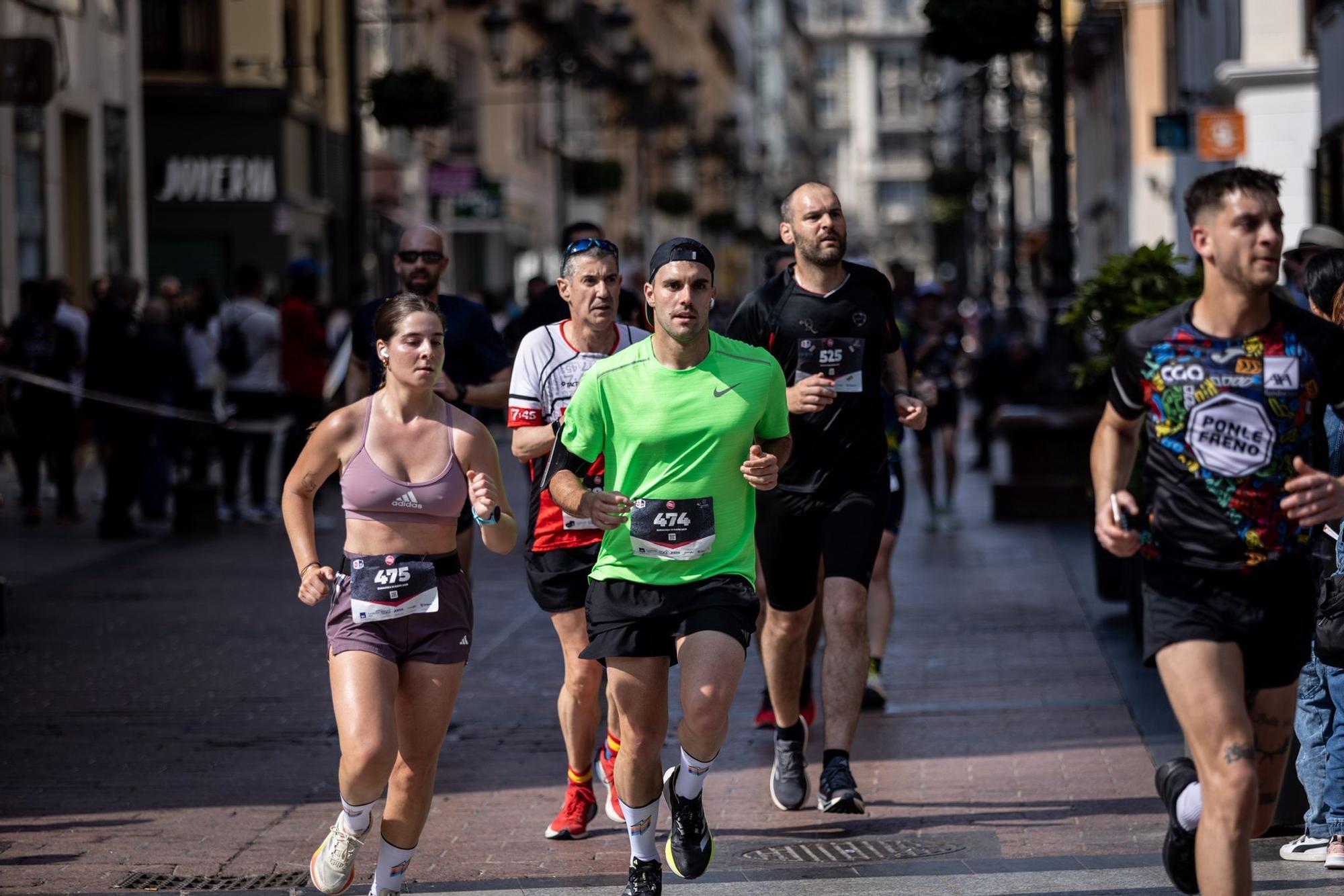En imágenes | La carrera Ponle Freno sca a la calle a miles de personas en Zaragoza