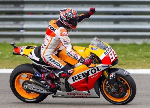 Honda MotoGP rider Marc Marquez of Spain celebrates his victory on his bike after winning the Dutch Grand Prix in Assen