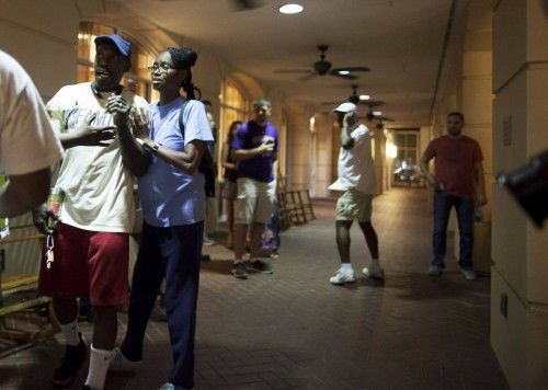 People concerned about relatives seek information from police nearby the scene of a shooting at the Emanuel AME Church in Charleston