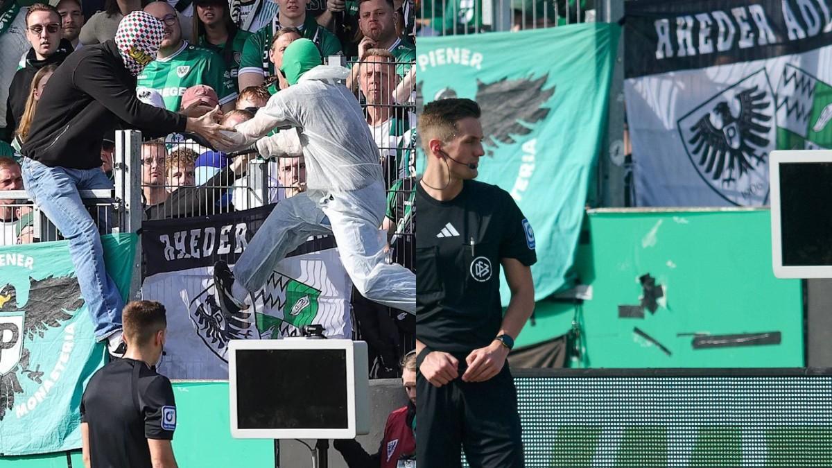 El árbitro Felix Bickel, ante una pantalla del VAR en negro en el Preußen Münster - Hertha Berlín de la 2. Bundesliga