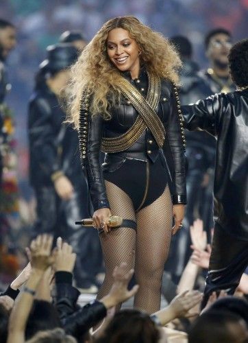 Beyonce smiles after performing during the half-time show at the NFL's Super Bowl 50 football game between the Carolina Panthers and the Denver Broncos in Santa Clara