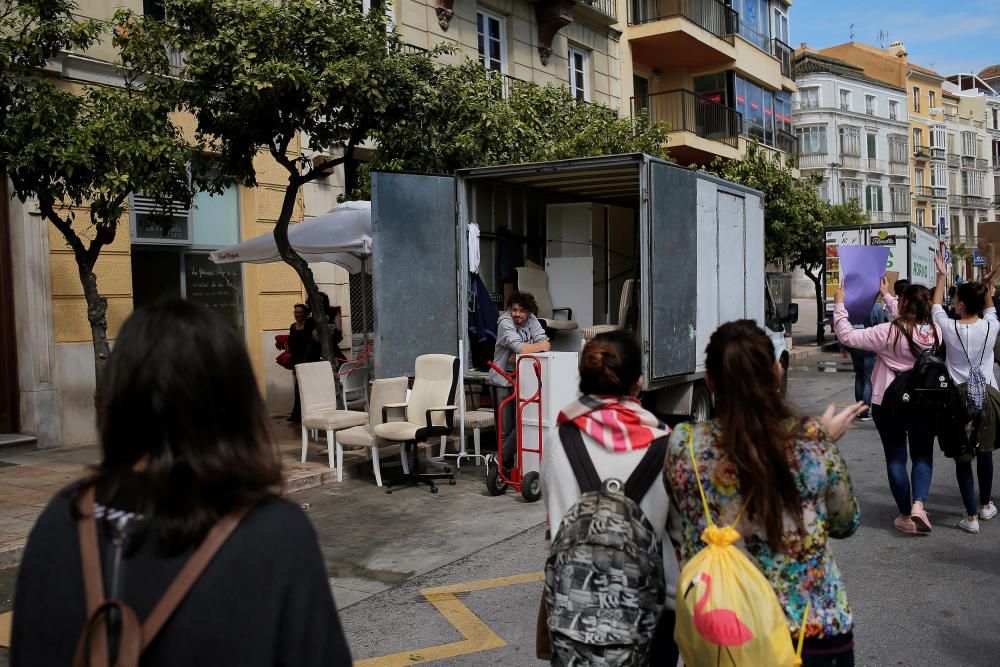 A man watches as women take part in a protest at ...