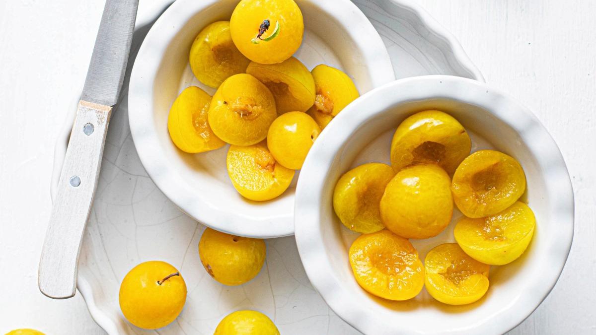 Fresh sliced mirabelle plums in a bowl