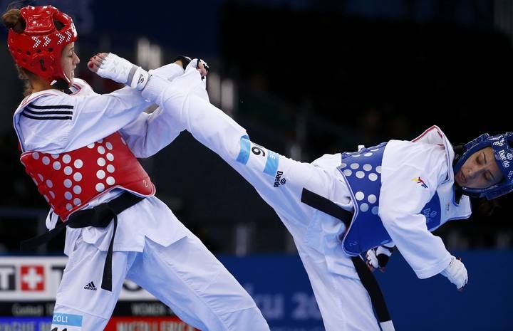 Nicoli of Italy and Yague of Spain fight during their women's 49kg preliminary round taekwondo match at the 1st European Games in Baku