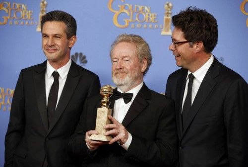 Ridley Scott, Simon Kinberg and Michael Scheafer pose with their award during the 73rd Golden Globe Awards in Beverly Hills