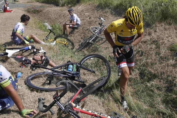 Race leader and yellow jersey holder Trek Factory rider Fabian Cancellara of Switzerland reacts after a fall during the third stage of the 102nd Tour de France cycling race from Anvers to Huy