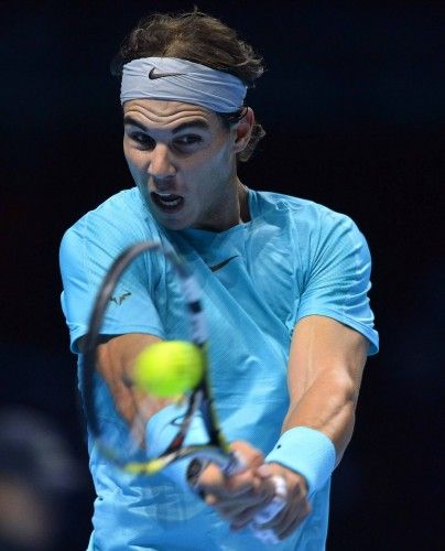 Nadal returns to Federer during his men's singles tennis match at the ATP World Tour Finals in London