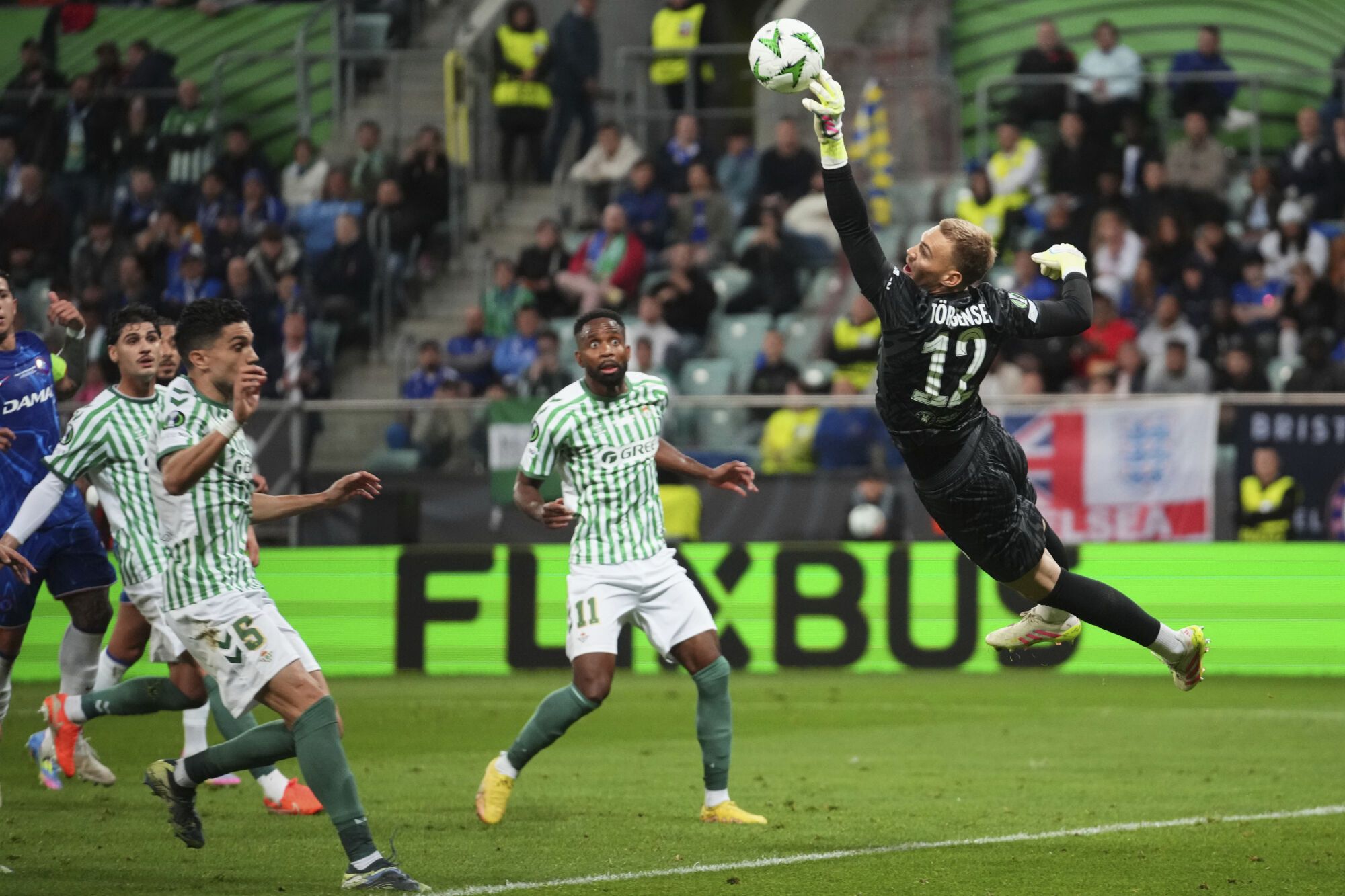 Chelsea's goalkeeper Filip Joergensen saves during the Europa League final soccer match between Real Betis and Chelsea in Wroclaw, Poland, Wednesday, May 28, 2025. (AP Photo/Petr David Josek)