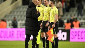Manchester Citys Spanish manager Pep Guardiola (L) speaks with English referee Chris Kavanagh and his assistants after the English League Cup semi-final first leg football match between Newcastle United and Manchester City at St James’ Park in Newcastle-upon-Tyne, north east England on January 13, 2026. City won the game 2-0. (Photo by Oli SCARFF / AFP) / RESTRICTED TO EDITORIAL USE. No use with unauthorized audio, video, data, fixture lists, club/league logos or live services. Online in-match use limited to 120 images. An additional 40 images may be used in extra time. No video emulation. Social media in-match use limited to 120 images. An additional 40 images may be used in extra time. No use in betting publications, games or single club/league/player publications. /. SEE CAPTION FOR MORE INFORMATION / RESTRICTED TO EDITORIAL USE. No use with unauthorized audio, video, data, fixture lists, club/league logos or live services. Online in-match use limited to 120 images. An additional 40 images may be used in extra time.