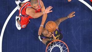 Los Angeles Lakers forward LeBron James, right, shoots as Los Angeles Clippers forward Nicolas Batum defends during the second half of an NBA basketball game Thursday, Jan. 22, 2026, in Inglewood, Calif. (AP Photo/Mark J. Terrill)