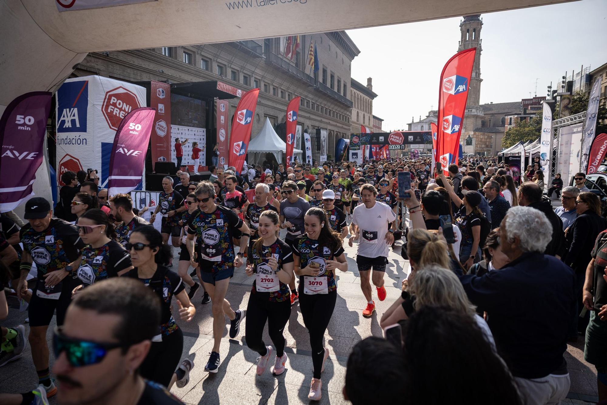 En imágenes | La carrera Ponle Freno sca a la calle a miles de personas en Zaragoza