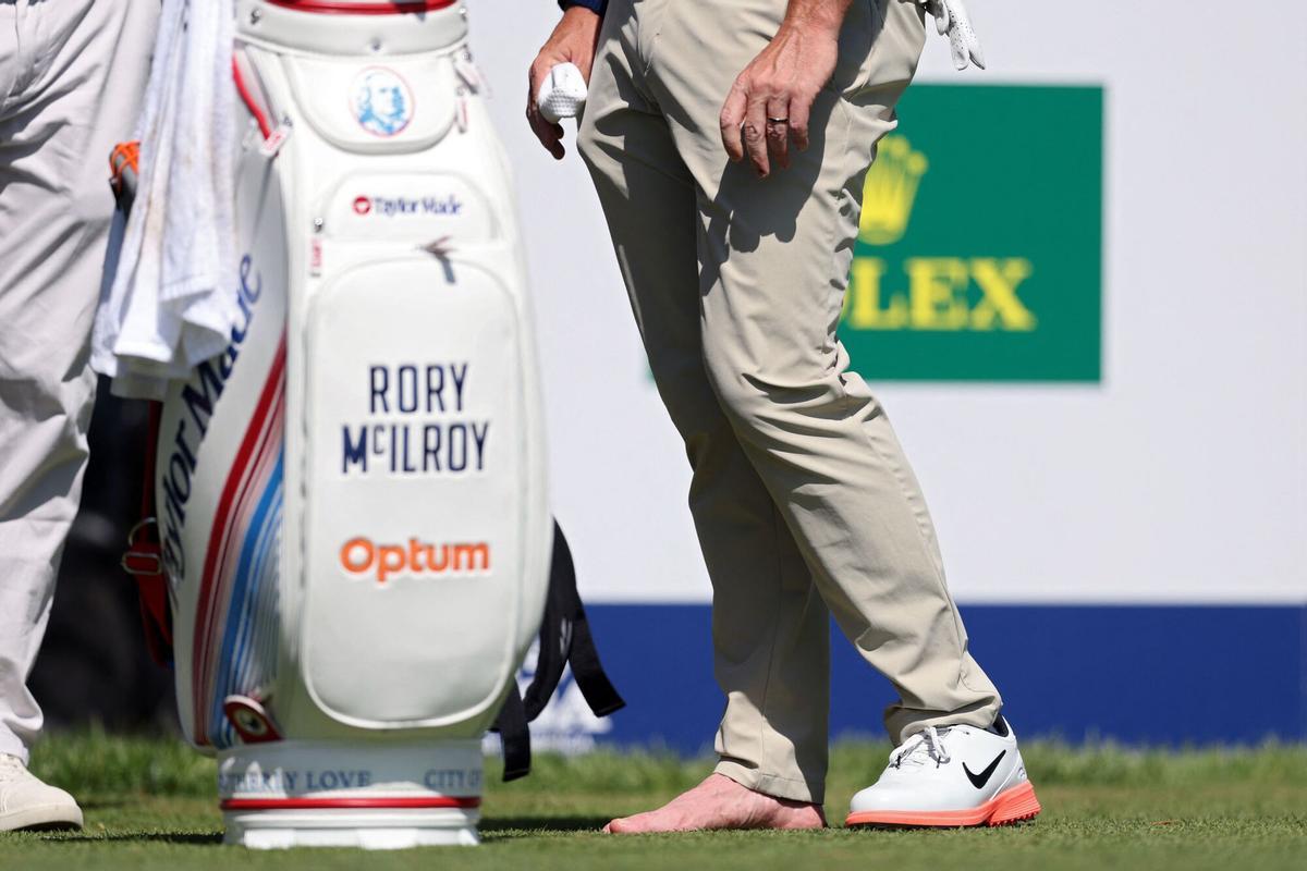NEWTOWN, PENNSYLVANIA - MAY 12: Rory McIlroy of Northern Ireland stands on the fourth tee with this shoe off during a practice round prior to the PGA Championship at Aronimink Golf Club on May 12, 2026 in Newtown, Pennsylvania. Emilee Chinn/Getty Images/AFP (Photo by Emilee Chinn / GETTY IMAGES NORTH AMERICA / Getty Images via AFP)