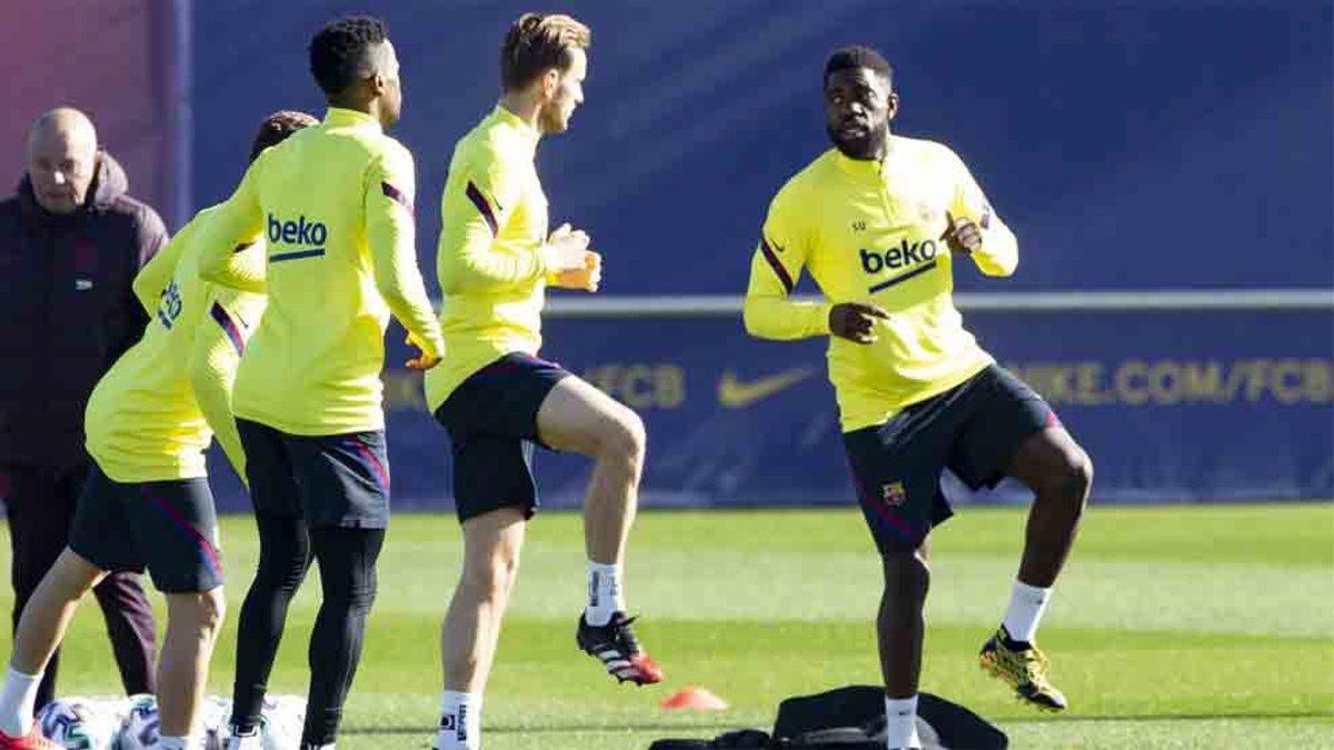 Umtiti y Rakitic, en un entrenamiento