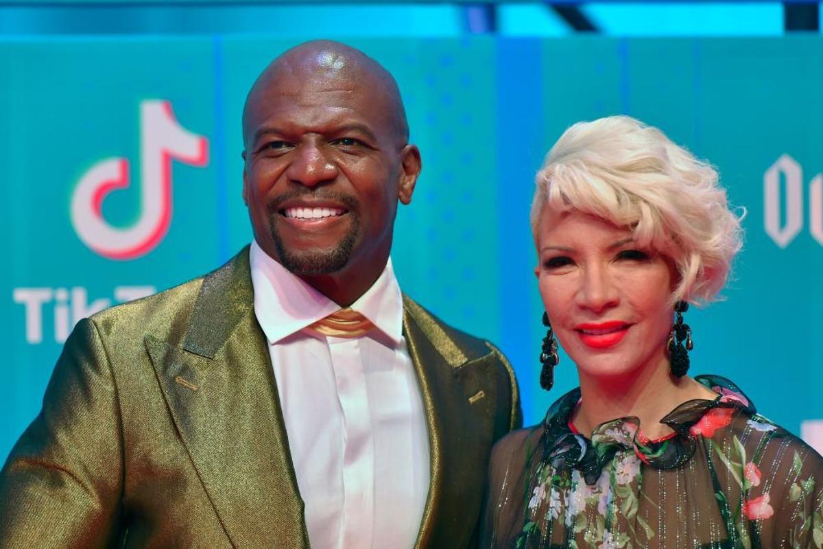 US actor Terry Crews and his wife Rebecca King-Crews pose on the red carpet ahead of the MTV Europe Music Awards at the Bizkaia Arena in the northern Spanish city of Bilbao on November 4, 2018. (Photo by ANDER GILLENEA / AFP)