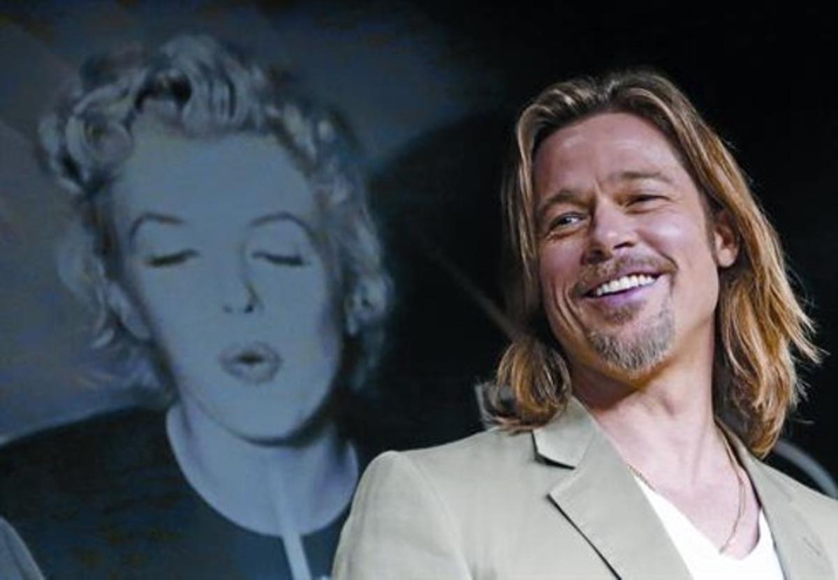 Brad Pitt, ahir, davant d’una fotografia de Marilyn Monroe, que protagonitza el cartell de Cannes. Brad Pitt, ahir, davant d’una fotografia de Marilyn Monroe, que protagonitza el cartell de Cannes.