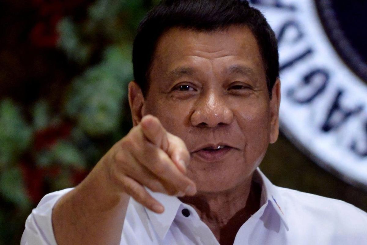 FILE PHOTO  Philippine President Rodrigo Duterte points to photographers during an awarding ceremony for outstanding government workers  at the Malacanang Palace in Manila  Philippines December 19  2016  REUTERS Ezra Acayan File Photo