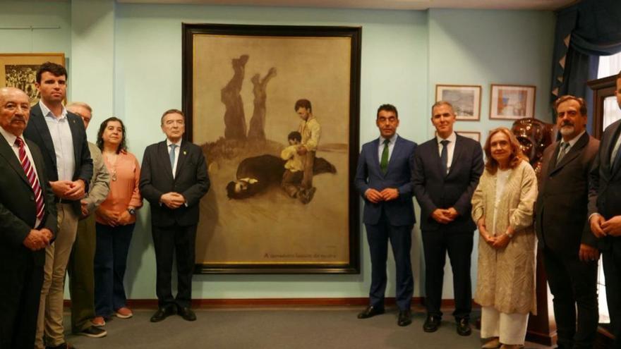 La delegación pontevedresa y miembros del Centro Galicia, junto al cuadro, ayer. |  FdV