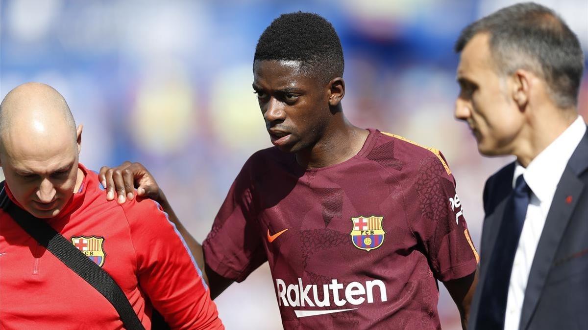 Dembéle abandona lesionado el campo del Getafe.