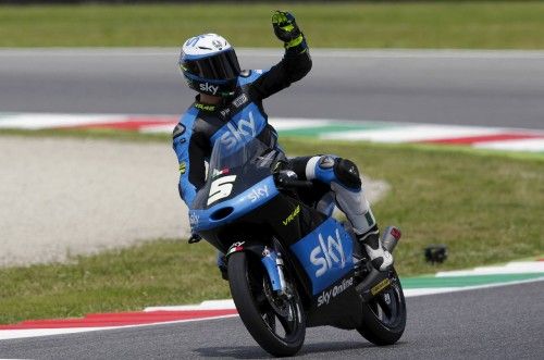 KTM Moto3 rider Fenati of Italy waves at the end of the qualifying session on his way to get the pole position for the Italian Grand Prix at the Mugello circuit