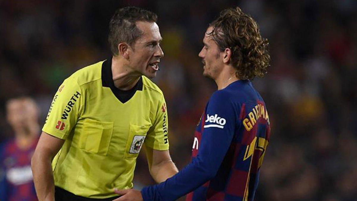 González y Griezmann, en un partido