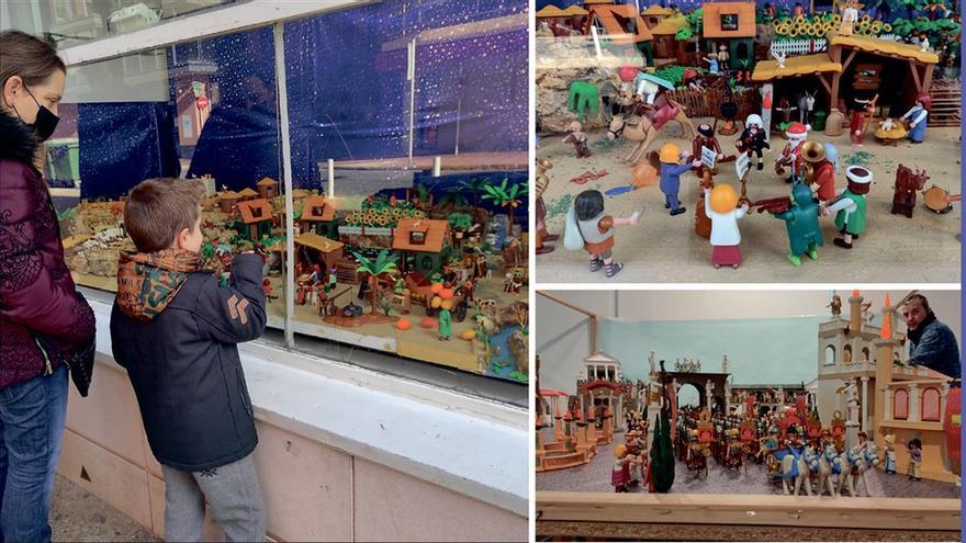 Los niños se asoman a la vitrina del centro cultural de Burriana a la espera de poder ver los dioramas del interior, donde ya han realizado el montaje.