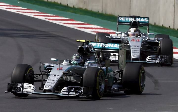 Mercedes Formula One drivers Nico Rosberg of Germany and Lewis Hamilton of Britain go into a turn together during the Mexican F1 Grand Prix at Autodromo Hermanos Rodriguez in Mexico City