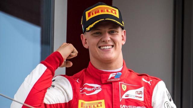 (FILES) In this file photo taken on August 4 2019 Prema Racing s German driver Mick Schumacher celebrates after winning the Formula Two championship race of the Hungarian Grand Prix at the Hungaroring circuit in Mogyorod near Budapest - Mick Schumacher the son of seven-time Formula One world champion Michael Schumacher won the Formula Two title in Bahrain on December 6 2020 four days after securing his breakthrough to F1 next season (Photo by ANDREJ ISAKOVIC AFP)