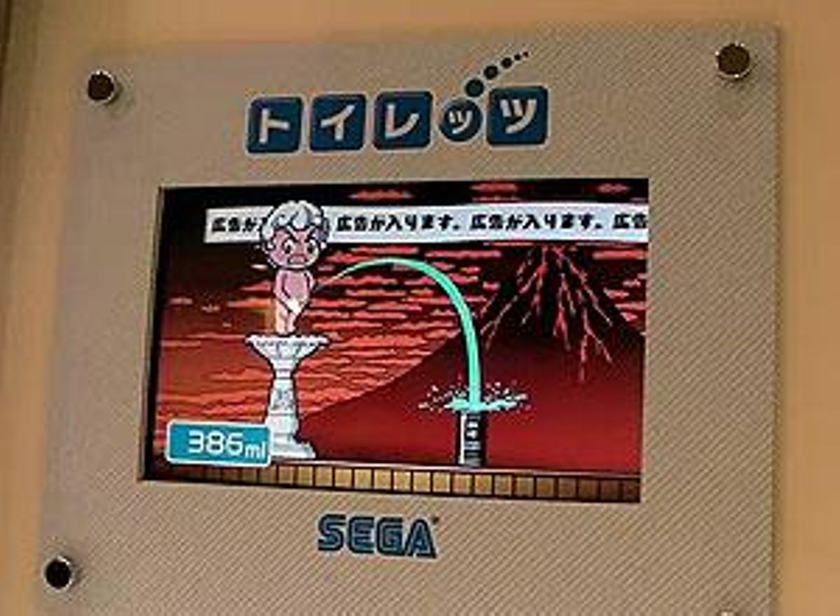 Estand promocional de la firma Sega, on es veu el funcionament del joc ’Toylet’.