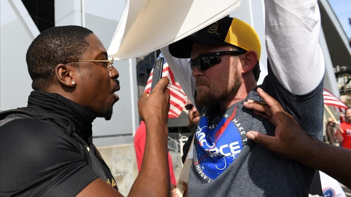 zentauroepp55767613 a man argues with a supporter of u s president donald trump201106194407 zentauroepp55767613 a man argues with a supporter of u s president donald trump201106194407