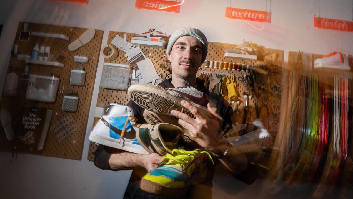 Salvatore poses with some of the sneakers he has customized.