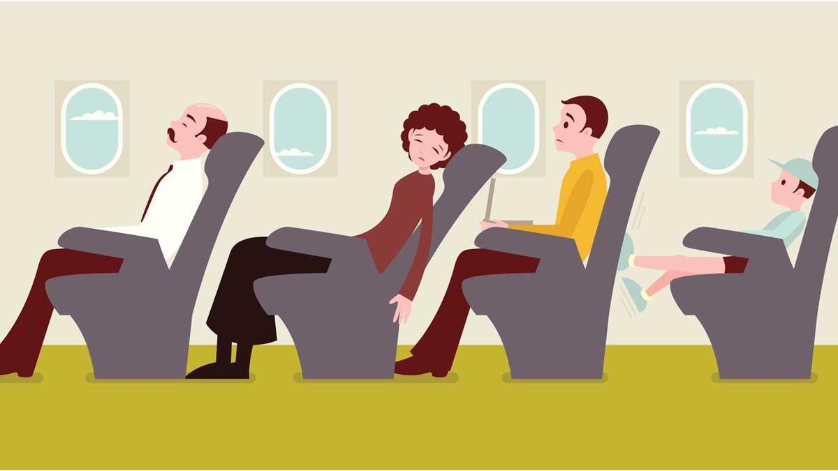 Economy class passengers on an airplane